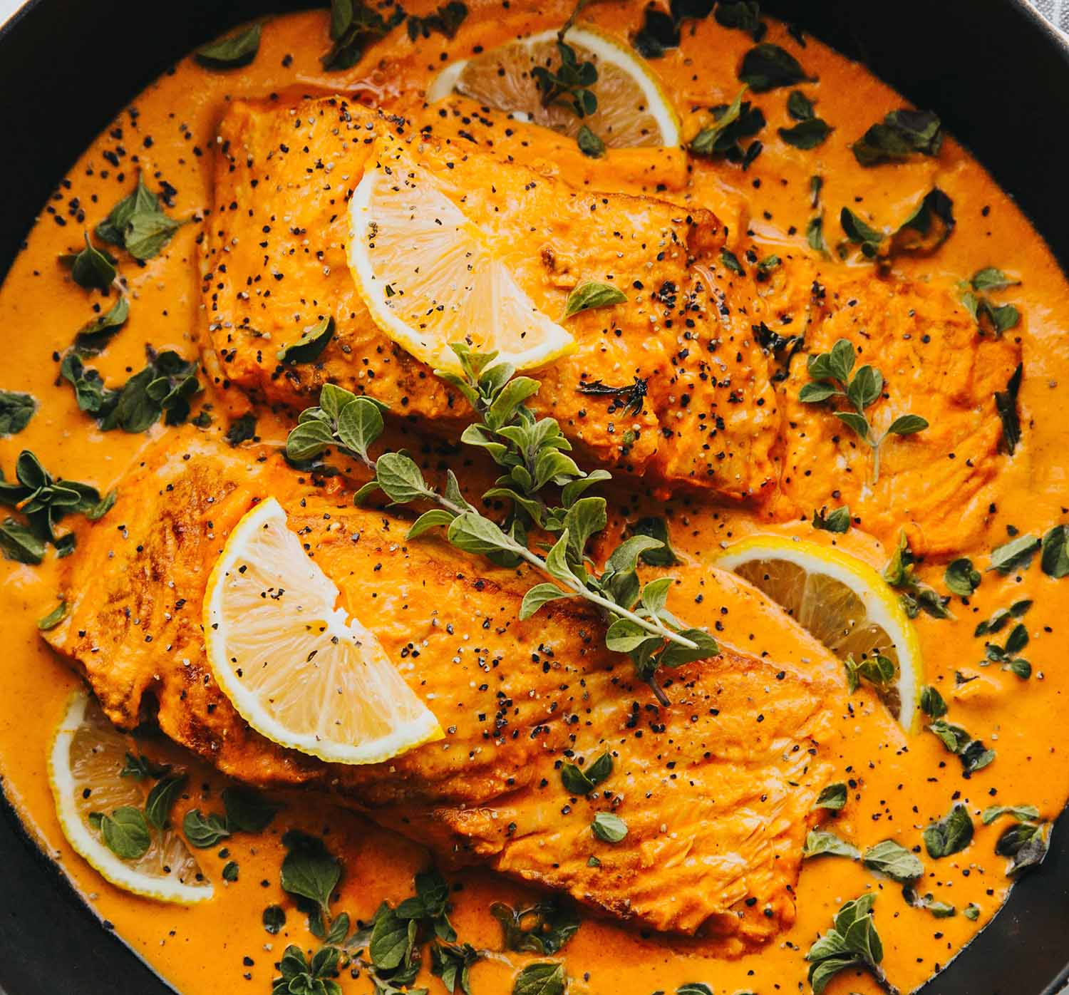 Tilapia in lemon sauce close-up.